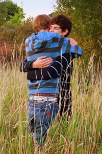 Two guys hugging - Photo Copyright TeeBe